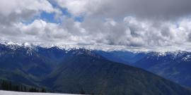 An expansive view of snowcapped Olympic Mountains as seen from Hurricane Ridge