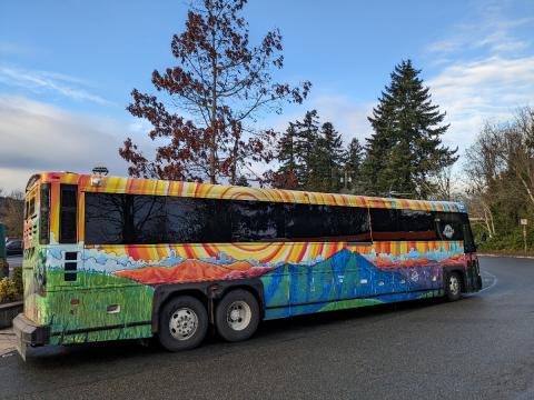 Picture of one of the unique decorated 123 Strait Shot Clallam Transit bus between the Bainbridge Ferry and downtown Port Angeles